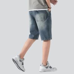 Make a statement this summer with our 2023 Summer Collection of ripped vintage denim shorts. designed for the modern man who loves the look and feel of street style. Showcase your individual style with these mid-waist shorts. featuring a zipper and button closure along with a unique. raw hem. Crafted with luxurious viscose. these shorts will keep you comfortable and stylish all day long.Distinctive Features: Street Style: Be bold and turn heads with these must-have ripped vintage denim shorts. R Denim Blue Knee-length Jean Shorts For Streetwear, Knee-length Denim Jean Shorts For Streetwear, Denim Blue Streetwear Shorts, Urban Style Short Jeans For Summer, Urban Style Summer Short Jeans, Urban Style Summer Shorts, Blue Knee-length Jean Shorts For Streetwear, Urban Knee-length Summer Shorts, Urban Denim Shorts