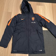 Super Rare, And Like New Condition. Never Worn Just No Tag. Dark Bay With Orange Highlights. Player Version. Nike Navy Winter Outerwear, Nike Navy Outerwear For Winter, Orange Highlights, Soccer Team, Padded Jacket, Blue Orange, Nike Jacket, Nike Men, Netherlands