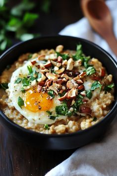 a bowl filled with oatmeal topped with an egg