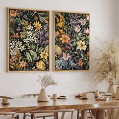 two paintings hanging on the wall above a dining room table with chairs and vases