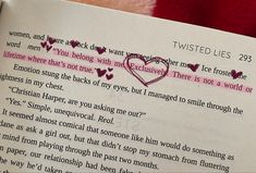 someone is holding up a book with a heart drawn on the page and it's written in pink ink