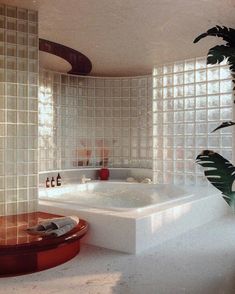 a bath tub sitting inside of a bathroom next to a palm tree in the corner