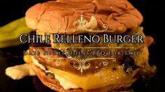 a grilled cheeseburger on a black plate with the words chile relleno burger