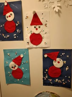 three snowmen made out of paper on the wall