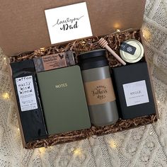 an open box containing coffee, tea and cookies