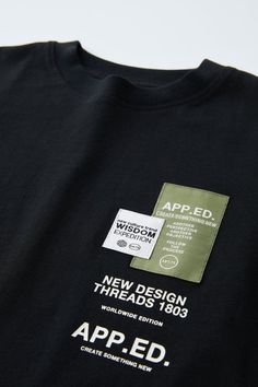 a black t - shirt with an apped label on it