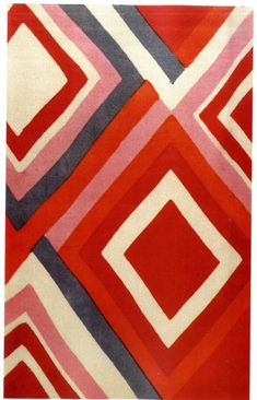 an area rug with red, grey and white designs