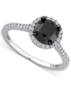 a black diamond ring with white diamonds around it