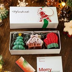 an open christmas gift box on a table