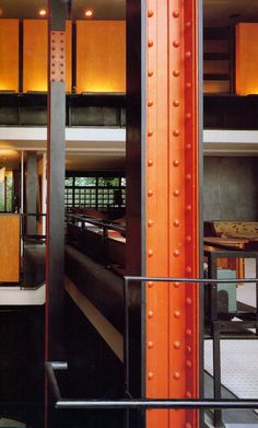 the inside of a building with metal and wood accents