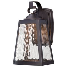 an outdoor wall light with a brown and white pattern on the glass paneled shade