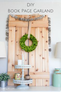 a wooden door with a wreath hanging on it's side and other decorations around it