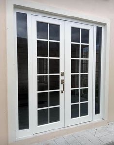 a white double door with glass on the outside