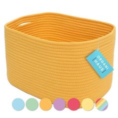 a yellow round basket with different colored circles on the side and a blue tag hanging from it