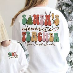 a woman wearing a santa's favorite teacher christmas t - shirt next to a christmas tree