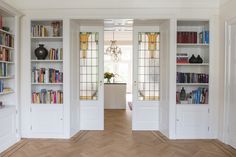 an empty room with bookshelves full of books