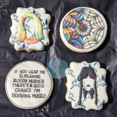 four decorated cookies with words on them and pictures in the shape of women's heads