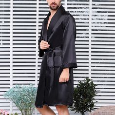 This Men's Black Satin Silk Long Sleeve Robe is made from high-quality satin silk, making it a luxurious choice for lounging. The lightweight fabric is comfortable and breathable, with an elegant drape. The long sleeves provide a classic silhouette for a timeless look. 95% Polyester, 5% Spandex Imported Tie closure Machine Wash Elegant Long Sleeve Formal Robe, Fitted Long Sleeve Solid Color Robe, Fitted Long Sleeve Solid Robe, Formal Fitted Long Sleeve Robe, Fitted Long Sleeve Silk Robe, Fitted Satin Night Robe, Evening Long Sleeve Satin Robe, Long Sleeve Satin Sleep Robe, Elegant Long Sleeve Silk Robe