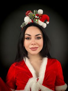 A dapper little santa hat, decorated with snowballs, a candy cane, bits of fir tree, and red berries. This whimsical Christmas headband will draw attention wherever you wear it! This is perfect for an office, school Christmas party, secret santa gift, or any time you want to bring smiles to a group. Treat yourself this holidays and add some fun to your Christmas outfit. Make those Christmas pics pop. Ready to come to you right away for the Holiday Season to add an extra bit of fancy to your fest Holiday Headband Gift, Whimsical Christmas Party Headband, Christmas Gift Hair Accessories With Matching Headband, Red Adjustable Mini Hat For Christmas, Adjustable Red Mini Hat For Christmas, Adjustable Red Mini Christmas Hats, Christmas Festive Headband Headpiece, Festive Christmas Headband, Whimsical Adjustable Christmas Headpieces