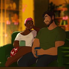 a man and woman sitting on a green couch