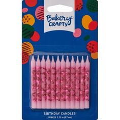 pink birthday candles are packaged in a package