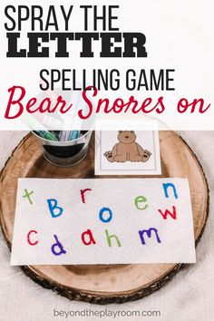 a sign that says, spray the letter spelling game bear snoozes on