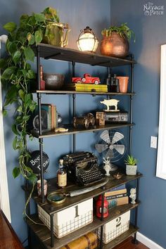 a shelf filled with lots of books next to a wall mounted clock and plant on top of it