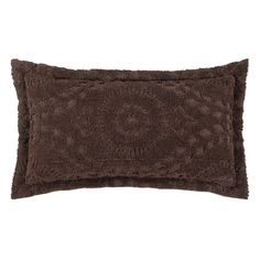 a brown pillow on a white background with an animal print design in the center and bottom