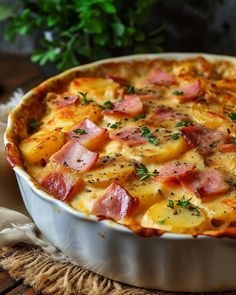 a casserole dish with ham and potatoes