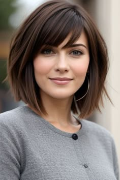 Looking for fresh haircut ideas for women? Explore stylish options like pixie cuts, lobs, and bangs that enhance your features and give you a trendy, modern look suitable for every occasion. Dark Brown Short Fine Hair, Short Hairstyle With Fringe Women, Women’s Short Hair With Bangs, Hair For 2025 Women, Chin Length Hair For Round Faces, Hairstyles For Women In 40s Fine Hair, Short Bob With Middle Part, Kelly Clarkson Bangs, Short Hairstyle Women No Bangs