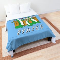 there is a bed with an image of two dinosaurs on it and the words otters written in large letters