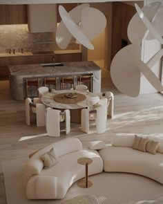 a living room filled with lots of furniture next to a kitchen and dining area on top of a hard wood floor