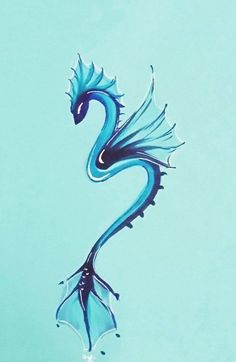 a blue dragon is floating in the water