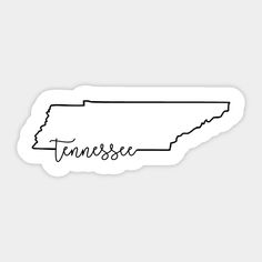 tennessee sticker with the word tennessee written in black ink on a white paper background