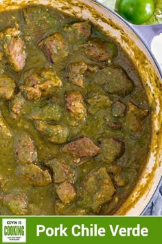 pork chile verde in a pot with green peppers on the side and text overlay that reads pork chile verde