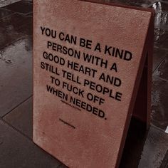 there is a sign on the sidewalk that says you can be a kind person with a good heart and still tell people to fo