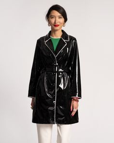 Our new raincoat draws inspiration from the iconic Morton Salt logo: that brightly-dressed, umbrellaed girl paving her path in the rain. Creating a water resistant coat with a feminine V-neck, adjustable belt, and oversized buttons – we designed this piece with functional yet daring style, so you can feel confident stepping into the storm. Vegan leather raincoat. Front button closure. Adjustable belt. Imported. Oversized Sweater Women, Double Breasted Trench Coat, Leather Trench, Trench Coat Black, Leather Trench Coat, Trench Coats Women, Designer Style, Liu Jo, Trendy Tops