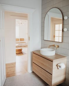 a bathroom with a sink and mirror in it