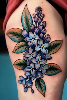 a woman's thigh with blue flowers on it