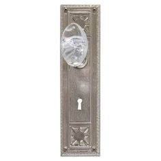 a door handle with a glass ball on the front and back panel, in an antique style