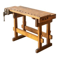 an old workbench that has been turned into a bench for the people to use