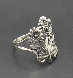 Sterling silver ring 925/1000, butterfly and flower .Stamped 925. Approximate weight 3.2 grams. Top width 2.2cm. All our jewels are made from solid sterling silver 925/1000 and are carefully crafted by hand in our family workshop. We dispatch your orders in 5 working days, worldwide and the postage is $5. We ship registered priority mail. Please allow 5-7 working days for delivery in Europe and 10-15 working days outside Europe. For any questions - please do not hesitate to contact me! Unique Sterling Silver Nickel-free Butterfly Ring, Unique Nickel-free Sterling Silver Butterfly Ring, Nickel-free Sterling Silver Butterfly Ring, Unique Butterfly Sterling Silver Ring, Unique Sterling Silver Butterfly Open Ring, Unique Sterling Silver Open Butterfly Ring, Sterling Silver Hallmarked Butterfly Wedding Ring, Sterling Silver Hallmarked Butterfly Ring For Wedding, Silver Flower Ring In Sterling Silver Stamped 925