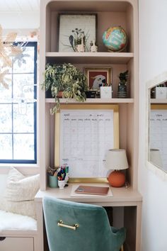 a desk with a chair and a calendar on it