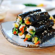 two pieces of sushi sitting on top of a plate