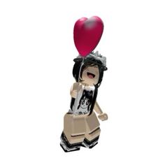 a lego figure holding a heart shaped balloon