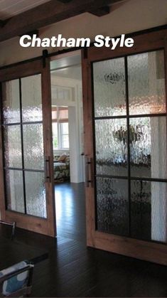 an empty room with sliding glass doors in it