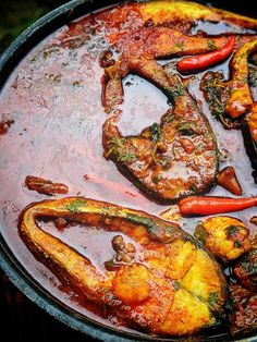 some food is cooking in a pot on the stove top and it looks like they have been cooked