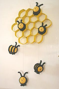 the bees are hanging on the wall