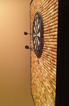 an image of a clock on the side of a door and another photo of a cat