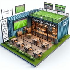 an outdoor sports venue with tables, chairs and televisions on the side of it